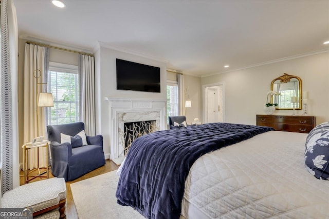 5 Prather Woods Ln, Augusta, GA 30909 - bedroom with a premium fireplace, wood finished floors, ornamental molding, and multiple windows