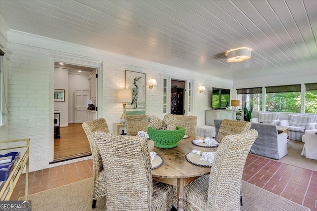 5 Prather Woods Ln, Augusta, GA 30909 - dining area with brick wall, wooden ceiling, and brick floor