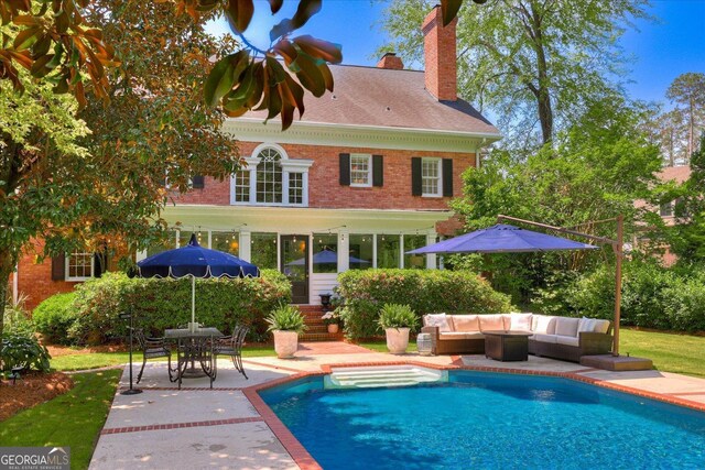 5 Prather Woods Ln, Augusta, GA 30909 - back of property featuring a patio area, an outdoor hangout area, a chimney, and an outdoor pool