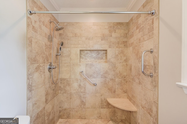 full bath with a shower stall and crown molding