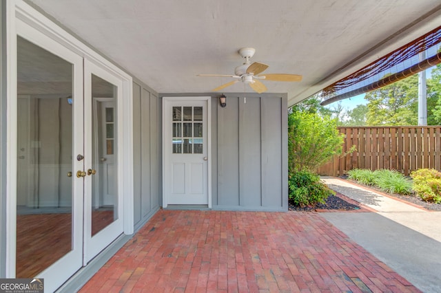 view of patio / terrace with fence, ceiling fan, and french doors