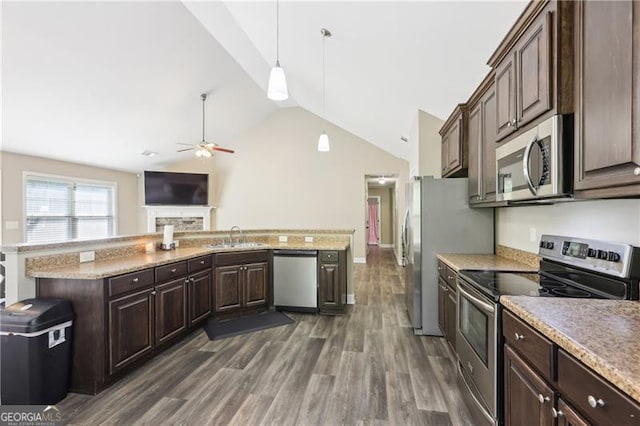 kitchen featuring appliances with stainless steel finishes, ceiling fan, dark brown cabinetry, and vaulted ceiling