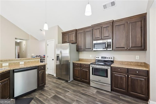 kitchen with visible vents, appliances with stainless steel finishes, hanging light fixtures, dark wood finished floors, and dark brown cabinets