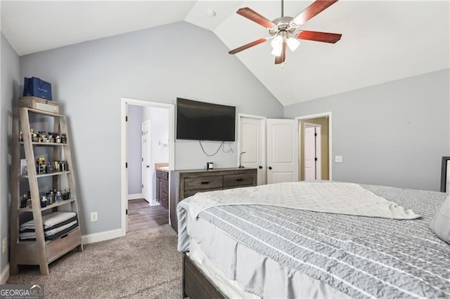 bedroom with ceiling fan, high vaulted ceiling, baseboards, carpet floors, and ensuite bathroom