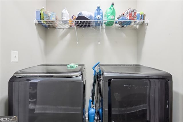 washroom featuring independent washer and dryer and laundry area