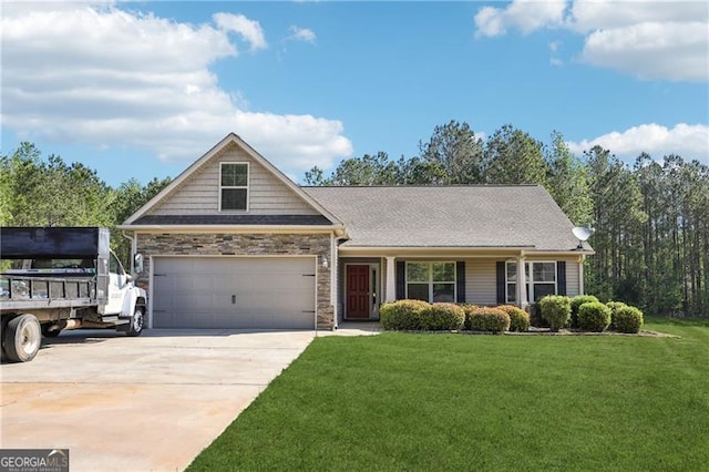 view of front of house featuring driveway, a front lawn, and stone siding