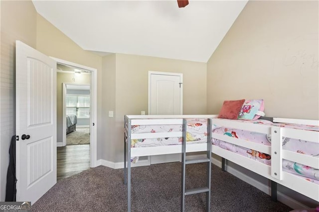 carpeted bedroom featuring a ceiling fan, baseboards, and lofted ceiling