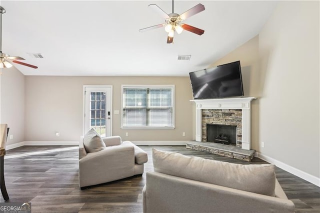 living room with visible vents, ceiling fan, wood finished floors, and vaulted ceiling