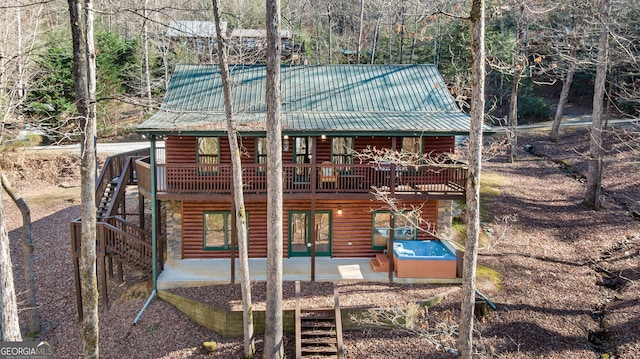 30 The Forest Rd, Blue Ridge, GA 30513 - exterior space featuring a wooden deck, log veneer siding, metal roof, and a patio