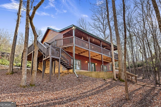 30 The Forest Rd, Blue Ridge, GA 30513 - rear view of property with faux log siding, stairway, and a deck