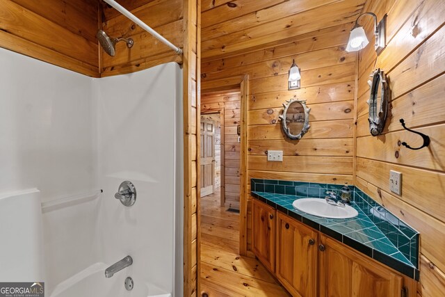30 The Forest Rd, Blue Ridge, GA 30513 - full bathroom with shower / washtub combination, wooden walls, vanity, and tasteful backsplash