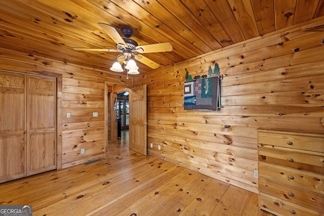 30 The Forest Rd, Blue Ridge, GA 30513 - unfurnished dining area with wood ceiling, a ceiling fan, wooden walls, and light wood-type flooring