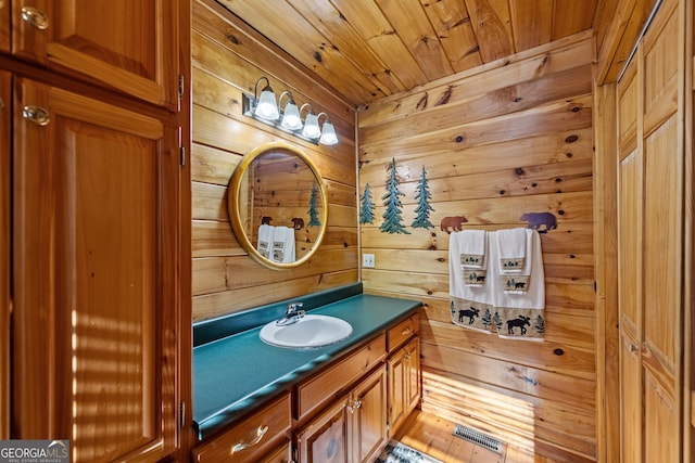 30 The Forest Rd, Blue Ridge, GA 30513 - bathroom featuring visible vents, wood walls, vanity, and wood ceiling