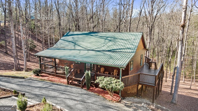 30 The Forest Rd, Blue Ridge, GA 30513 - view of front of house with log exterior, metal roof, and a deck