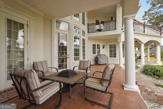 view of patio with a balcony