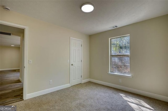 479 Lakeview Dr, Dahlonega, GA 30533 - unfurnished bedroom featuring visible vents, carpet flooring, and baseboards