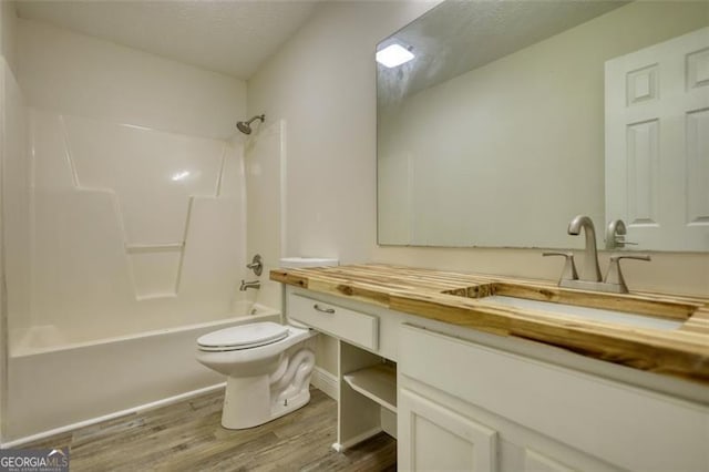 479 Lakeview Dr, Dahlonega, GA 30533 - full bathroom with wood finished floors, toilet, vanity, and shower / bathtub combination