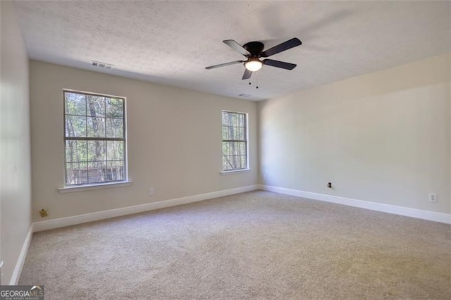 479 Lakeview Dr, Dahlonega, GA 30533 - carpeted empty room with baseboards, a ceiling fan, a textured ceiling, and visible vents