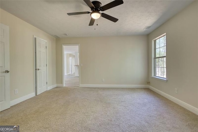 479 Lakeview Dr, Dahlonega, GA 30533 - carpeted empty room with baseboards, a ceiling fan, a textured ceiling, and visible vents
