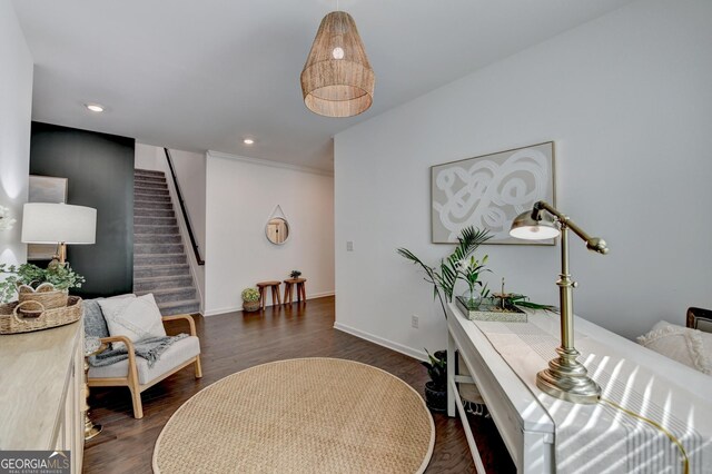 sitting room featuring stairs, dark wood-style floors, baseboards, and recessed lighting