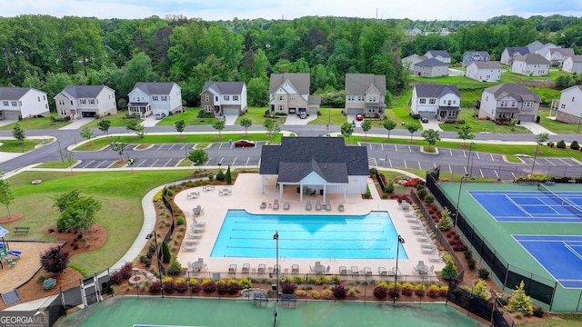 aerial view of residential area with a pool