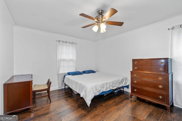 bedroom with baseboards, wood finished floors, ceiling fan, and ornamental molding