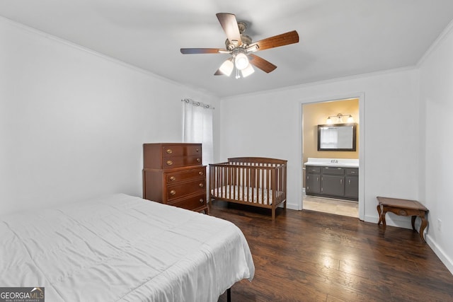 bedroom with wood finished floors, ceiling fan, crown molding, and baseboards