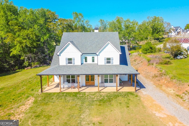 5315 Hendrix Rd, Cumming, GA 30040 - farmhouse inspired home with gravel driveway, a shingled roof, a front lawn, and a chimney