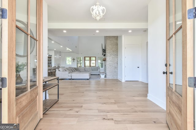 5315 Hendrix Rd, Cumming, GA 30040 - entryway featuring baseboards, light wood-type flooring, recessed lighting, and a notable chandelier