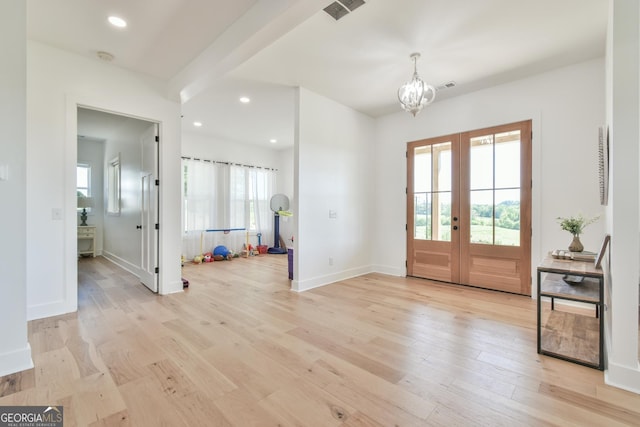 5315 Hendrix Rd, Cumming, GA 30040 - entryway with light wood-style floors, an inviting chandelier, french doors, and visible vents