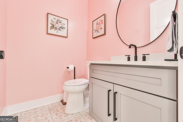 5315 Hendrix Rd, Cumming, GA 30040 - half bathroom featuring vanity, baseboards, and toilet