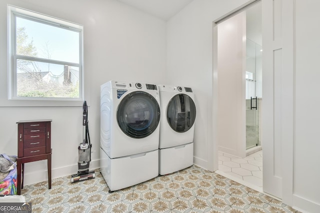 5315 Hendrix Rd, Cumming, GA 30040 - laundry room with light tile patterned floors, laundry area, washing machine and dryer, and baseboards