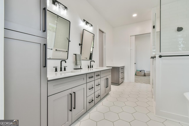 5315 Hendrix Rd, Cumming, GA 30040 - full bathroom with tile patterned flooring, double vanity, walk in shower, recessed lighting, and a sink