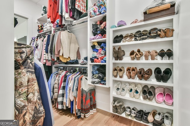 5315 Hendrix Rd, Cumming, GA 30040 - walk in closet featuring wood finished floors
