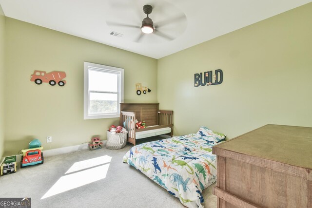 5315 Hendrix Rd, Cumming, GA 30040 - carpeted bedroom featuring ceiling fan and visible vents