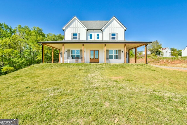5315 Hendrix Rd, Cumming, GA 30040 - view of front of house with board and batten siding, french doors, and a front yard