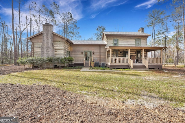 590 Dogwood Way, Richmond Hill, GA 31324 - back of property with a chimney, a deck, a yard, metal roof, and crawl space