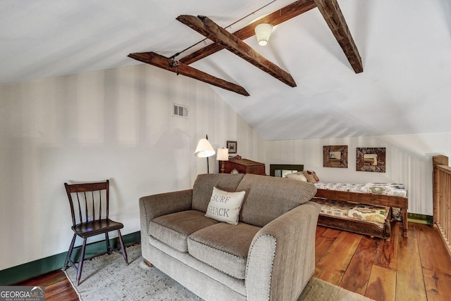 590 Dogwood Way, Richmond Hill, GA 31324 - living area featuring visible vents, vaulted ceiling with beams, and hardwood / wood-style flooring