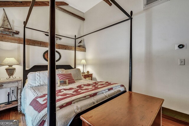 590 Dogwood Way, Richmond Hill, GA 31324 - bedroom featuring visible vents and wood finished floors