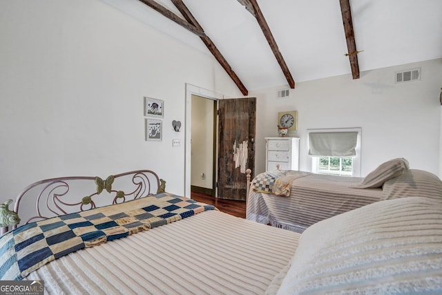 590 Dogwood Way, Richmond Hill, GA 31324 - bedroom featuring visible vents, beam ceiling, wood finished floors, and high vaulted ceiling