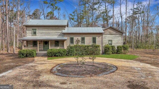 590 Dogwood Way, Richmond Hill, GA 31324 - view of front facade featuring covered porch and metal roof