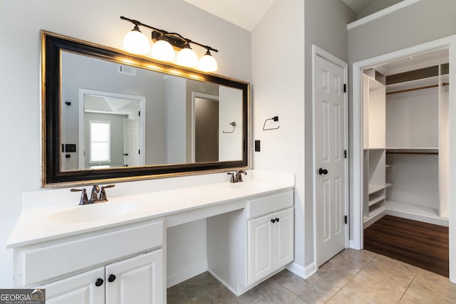 1650 Berryhill Rd, Cumming, GA 30041 - bathroom with tile patterned floors, visible vents, a sink, and double vanity