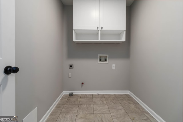 1650 Berryhill Rd, Cumming, GA 30041 - laundry room with gas dryer hookup, hookup for a washing machine, baseboards, electric dryer hookup, and cabinet space