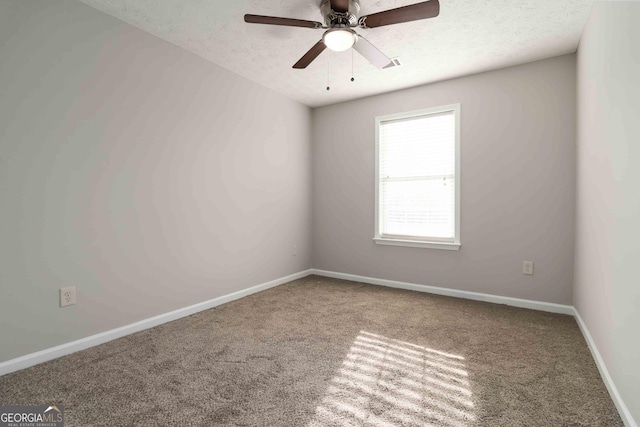 1650 Berryhill Rd, Cumming, GA 30041 - empty room featuring a textured ceiling, carpet flooring, baseboards, and ceiling fan