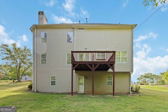 1650 Berryhill Rd, Cumming, GA 30041 - back of house featuring a wooden deck, a yard, and a chimney