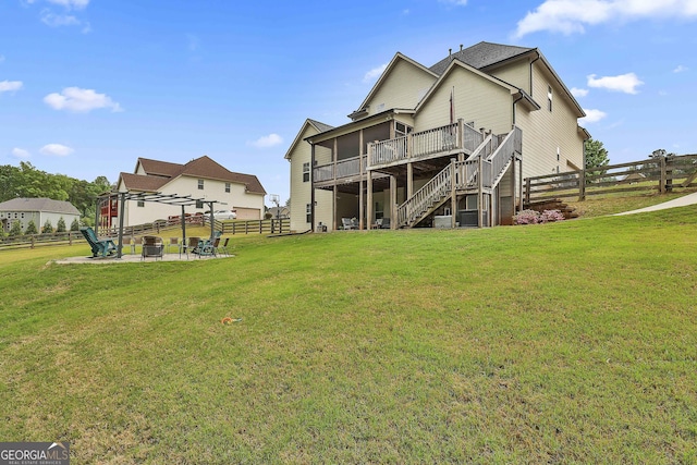 237 Northgate Preserve Dr, Newnan, GA 30265 - back of property with stairway, a lawn, a wooden deck, and a fenced backyard