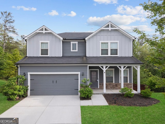 1953 Azure Grove Ct, Marietta, GA 30008 - craftsman-style home featuring a front lawn, driveway, board and batten siding, covered porch, and a garage