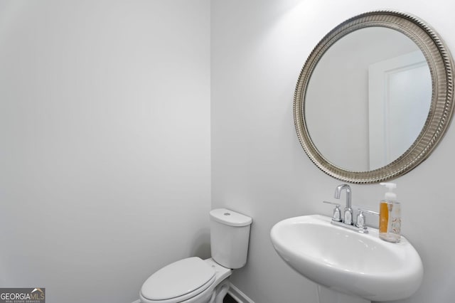 1953 Azure Grove Ct, Marietta, GA 30008 - half bath featuring toilet, baseboards, and a sink