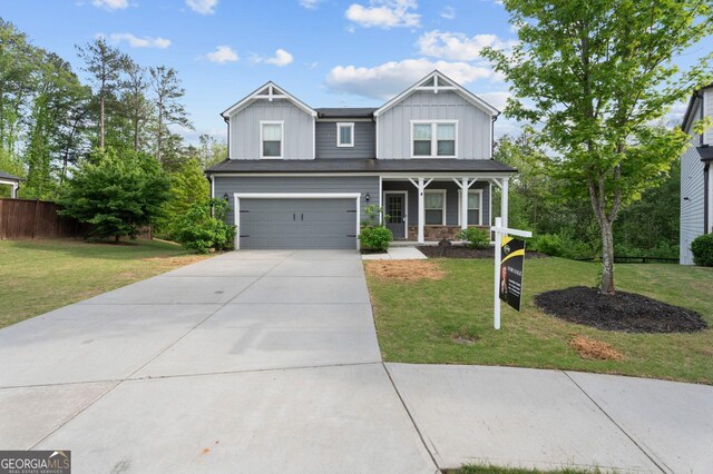 1953 Azure Grove Ct, Marietta, GA 30008 - craftsman-style house featuring fence, board and batten siding, driveway, covered porch, and a front yard