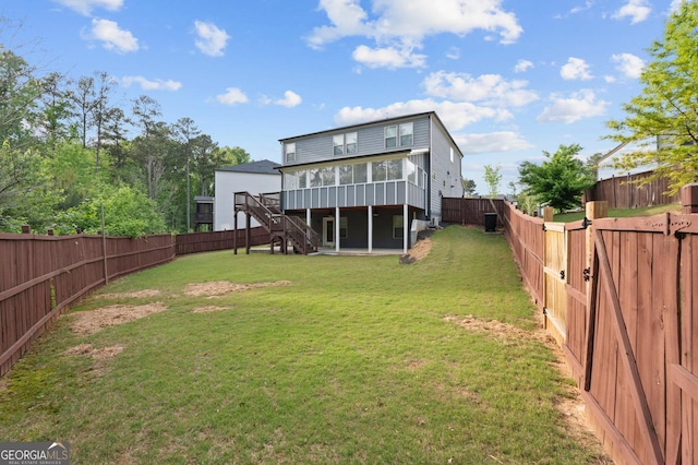 1953 Azure Grove Ct, Marietta, GA 30008 - back of house featuring stairway, a fenced backyard, a yard, a wooden deck, and a sunroom
